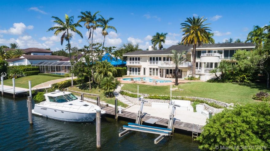 Located on desirable Riviera Dr in Coral Gables, this 4 bed/4.5 bath estate boasts 115 ft of waterfrontage with newly expanded private dock and boat lift, oversized rooms with the master suite situated on its own floor, media room, office, 2 wet bars and  panoramic views. Enjoy the convenience of only one bridge to bay on Gables Waterway or easy entertaining from 1300 ft of outdoor terraces overlooking the sparkling pool. Updated impact windows throughout.