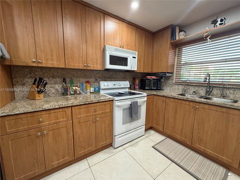 Photo of 9741 Sunrise Lakes Blvd #107, Sunrise, FL 33322 (MLS # A11909886)