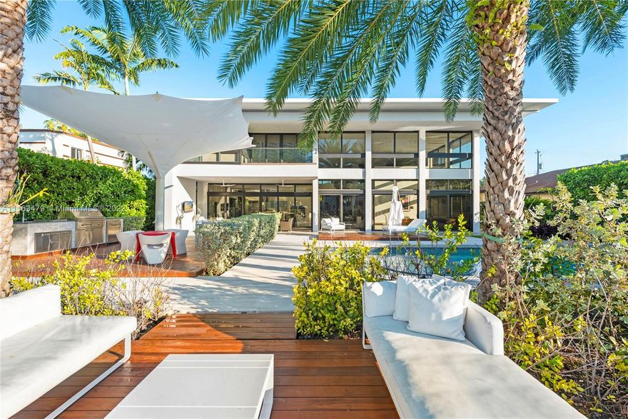 This one-of-a-kind masterpiece is located in the exclusive neighborhood of Golden Isles. Sitting right on the water boasting  85 ft private dock.This house offers beautiful water views and easy access to the Intracoastal waterway. The landscape is professionally designed like no other. Excellent location, between Fort Lauderdale and South Beach.The house comes with a grand chef’s kitchen, all vaulted ceilings, impact windows throughout that allow great amounts of light into the house. Smart home technology is integrated. Speakers in all common areas, including the backyard oasis that's perfect for all types of gatherings. Backyard includes a pool, jacuzzi, and outdoor grill with dining area and covered terrace.Spectacular movie theater, home gym, large office space and convenient elevator.