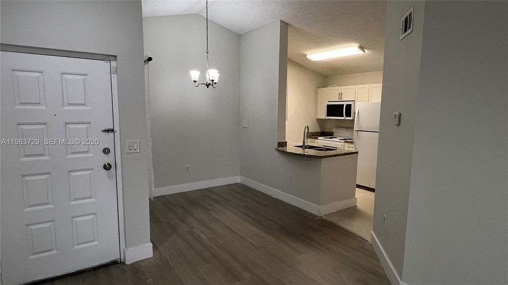 Photo of 2810 N Oakland Forest Dr #313, Oakland Park, FL 33309 (MLS # A11963729)