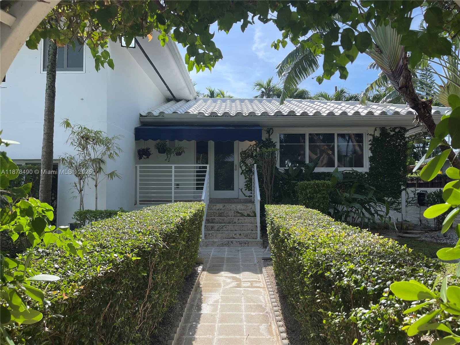 Perfect Resort Style living in hip and upcoming Davis Harbor! Magnificent and remodeled 2- story pool home with amazing tropical landscaped yard and Pool area. Open living space with access to an oversized porch perfect for entertaining and outdoor living concept. Lot's of natural light and plenty of closet space. Wood floors in living area and upstairs bedrooms and marble floors 2 downstairs bedrooms. Additional guest cottage with separate entrance. Home features include Impact glas windows, energy efficient solar panels, salt water heated pool, updated electric and plumbing and portable generator. This is your perfect Florida Home and a must see! The hidden secret just S of Miami Shores and E of Biscayne Blvd.
