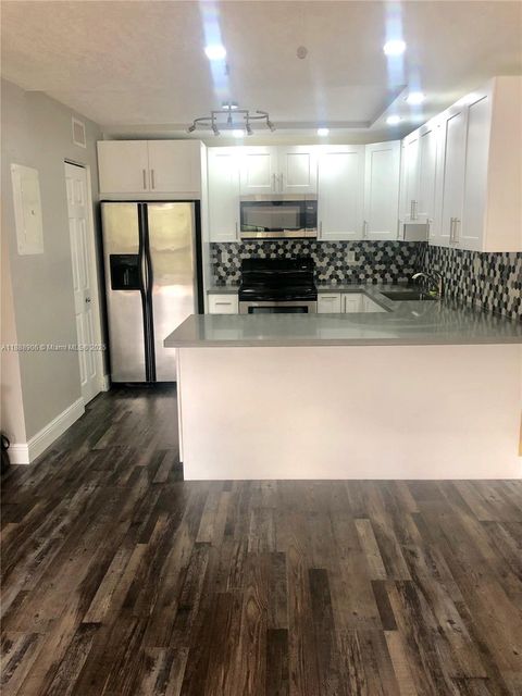 Photo of 8810 SW 132nd Pl #404DN, Miami, FL 33186 (MLS # A11888906)