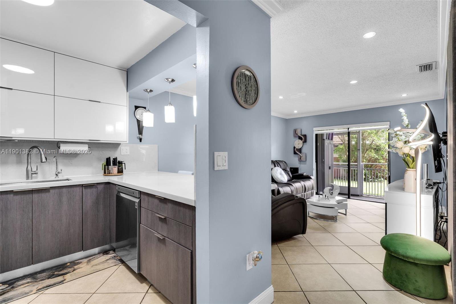 Beautifully remodeled 2/2 first-floor condo in prime Miami location! Modern kitchen with stone countertops, new wood cabinets, spacious custom closets, and updated bathrooms. Includes in-unit washer and dryer with all high-quality appliances. Two assigned parking spaces, ample guest parking, low HOA, and private screened balcony. Close to expressways, shopping, dining, and Miami International Airport.