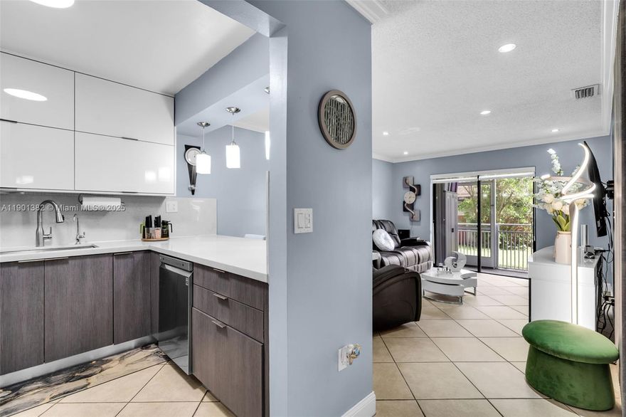 Beautifully remodeled 2/2 first-floor condo in prime Miami location! Modern kitchen with stone countertops, new wood cabinets, spacious custom closets, and updated bathrooms. Includes in-unit washer and dryer with all high-quality appliances. Two assigned parking spaces, ample guest parking, low HOA, and private screened balcony. Close to expressways, shopping, dining, and Miami International Airport.