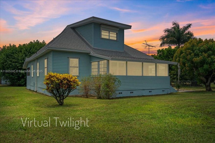 REDUCED!!!  Charming 2 story 4BR/2BA Old Florida home on 1.67 acres in Homestead! Features wood floors, spacious front & back porches, whole house generator and fully fenced yard.  Enjoy mature avocado grove, mango and banana trees with irrigation, a 3-stall horse barn, and a huge 38x48 workshop with safe room + studio apartment.  This workshop/RV style garage is ideal for hobbies, home business, or guest space. This property is perfect for equestrian lovers, hobby farmers, or anyone with big toys. We love the tranquil rural setting with easy access to city conveniences. A rare Homestead gem with income and lifestyle potential!