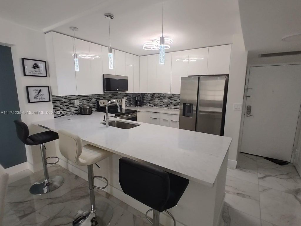 Photo of 3725 S Ocean Dr #307, Hollywood, FL 33019 (MLS # A11175235)