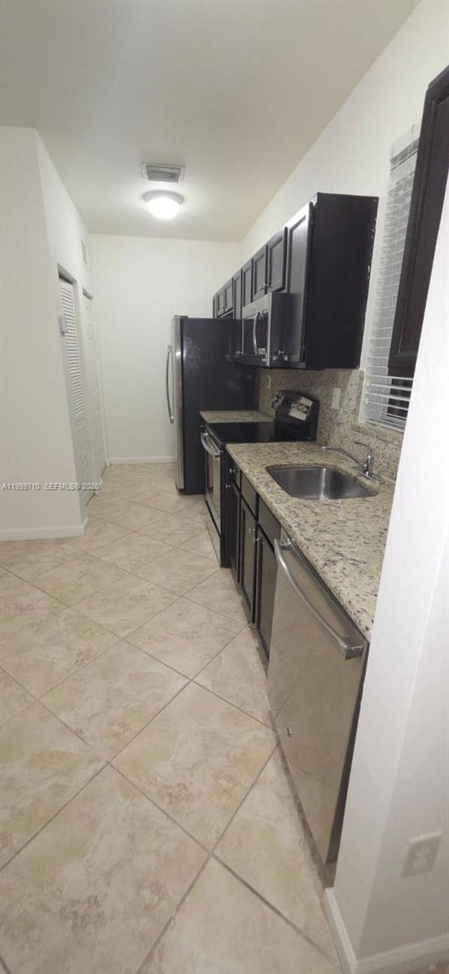Spacious studio!!! The unit features central air conditioning, an in-unit washer and dryer, a stove with oven, and a large double-door refrigerator. Parking is available for one vehicle only.