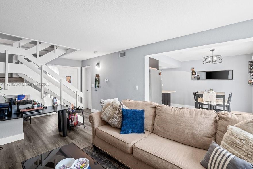 Embrace the perfect blend of comfort and style in this recently fully renovated townhouse, just minutes from the beach! Enjoy the sleek look of new vinyl flooring, new AC unit, 2 Bedrooms, 1.5 bath, walking closets, 2 parking spaces, washer/ Dryer, an open and airy living space, custom kitchen cabinets, cooking isle, stainless still appliances, and a cozy patio for relaxing or entertaining. No rental restrictions, no special assessments & All Ages welcomed. With its updated design and ideal location, this home is ready to move in and enjoy!