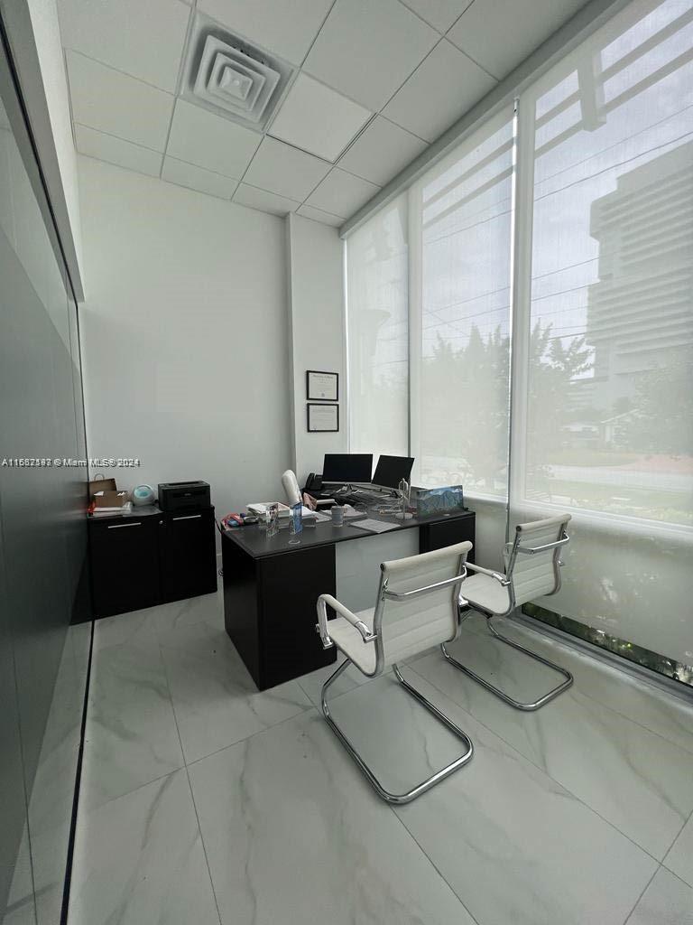 Office Space for Rent! This modern 430 sq ft corner unit at Beacon Hallandale is move-in ready. Located on the first floor of a 2019 building, it includes one assigned parking space at no extra cost. Enjoy amenities like a reception area, conference rooms, and a cafeteria. Perfectly situated across from Gulfstream Mall and close to Aventura Hospital, Target, and Whole Foods, this area is undergoing significant redevelopment. Act now—contact the listing agent for an easy showing! Don’t miss this chance to rent in a thriving location!