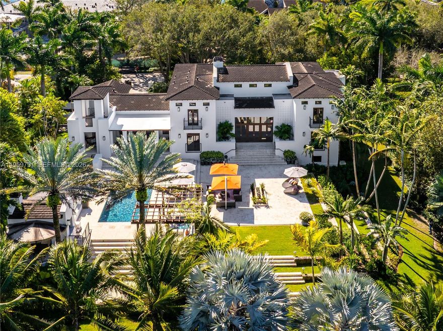 Welcome to 555 Arvida Pkwy- a stunning Mediterranean AND Modern estate on over an acre in coveted Gables Estates! Renovated from top to bottom in 2015, this 6 bedroom, 6/2 bath residence offers 13,147sf of resort-style living space on three levels.  A yachtsman's paradise, with 180ft of frontage (w/ 100ft dock & boat lift), it can easily accomodate multiple vessels. Beautiful modern interiors include soaring ceilings, large windows, a billiard room with spectacular see-through aquarium wall to an office/study, 5000-bottle wine cellar/tasting room, and a chef's kitchen adjacent to a large family room with ample bar seating. On the lower level, you'll find an expansive gym (with full bath and sauna), huge playroom, theater, and 2-bedroom staff quarters along
with ample flex space for storage and other uses.  Garage parking for 5+ cars and an elevator. Approved plans to expand are available. This is one of only 24 homes in all of Gables Estates with exclusive access to the private Leucadendra tennis courts, making this your own private country club! Furniture available separately (all artwork, wine, and personal property excluded). Seller-financing available.  555 Arvida is, by far, the best value move-in condition home in all of Gables Estates!