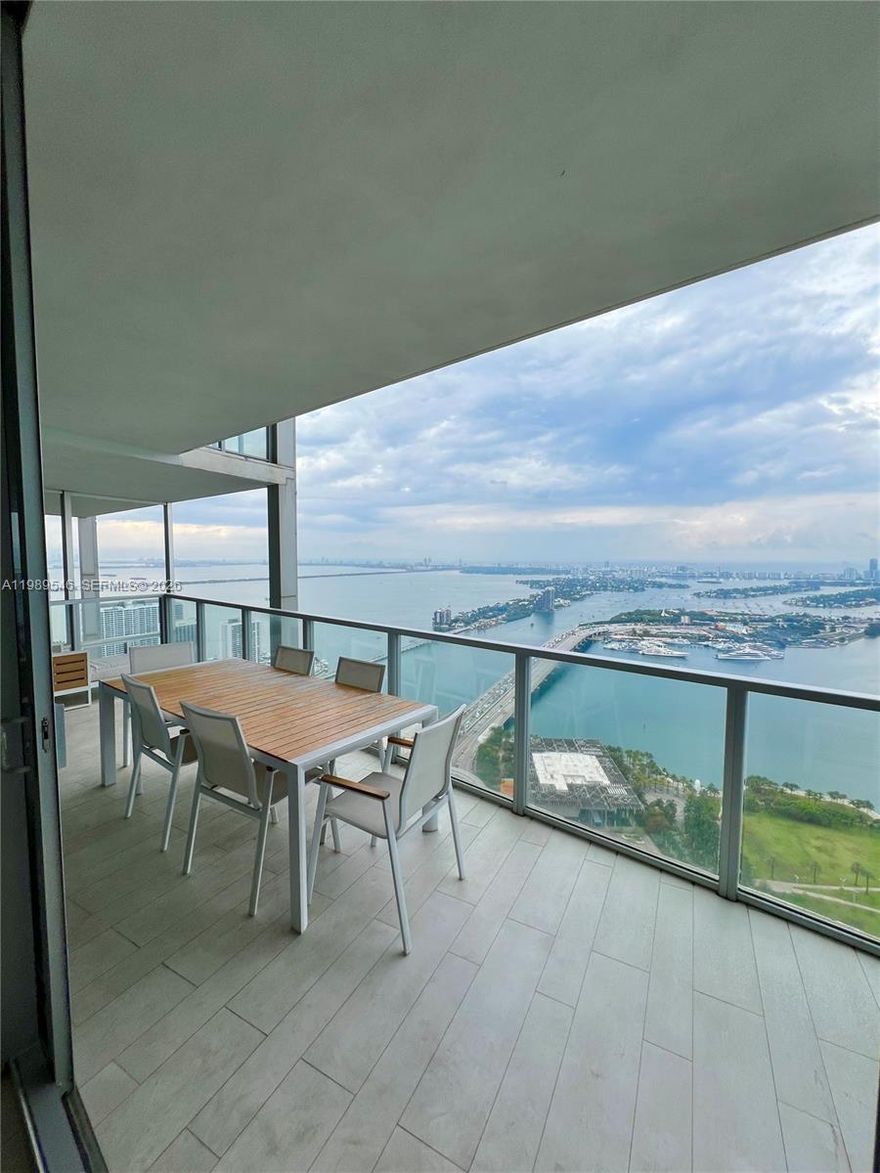 Rarely available ultra-high floor residence at Marquis Residences! This stunning 2-bedroom, 2.5-bath unit at Marquis Miami offers direct, unobstructed Biscayne Bay views from every room. Enter via your private elevator into a beautifully appointed, fully furnished home featuring floor-to-ceiling impact glass, an open-concept layout, and expansive living areas designed to capture breathtaking sunrise and water vistas.

The split-bedroom floor plan ensures maximum privacy, while the modern kitchen is equipped with high-end appliances and sleek finishes. Enjoy seamless indoor-outdoor living with a spacious terrace overlooking the bay.

Located in one of Downtown Miami’s premier full-service luxury towers, residents enjoy world-class amenities including 24-hour concierge, resort-style pools, state-of-the-art fitness center, spa, on-site dining, and exclusive beach club access. Marquis Miami is ideally situated across from Museum Park and just minutes to Miami Beach, Brickell, and the city’s top dining and entertainment.

Offered fully furnished and move-in ready. A true sky residence for those seeking luxury, privacy, and unparalleled views.