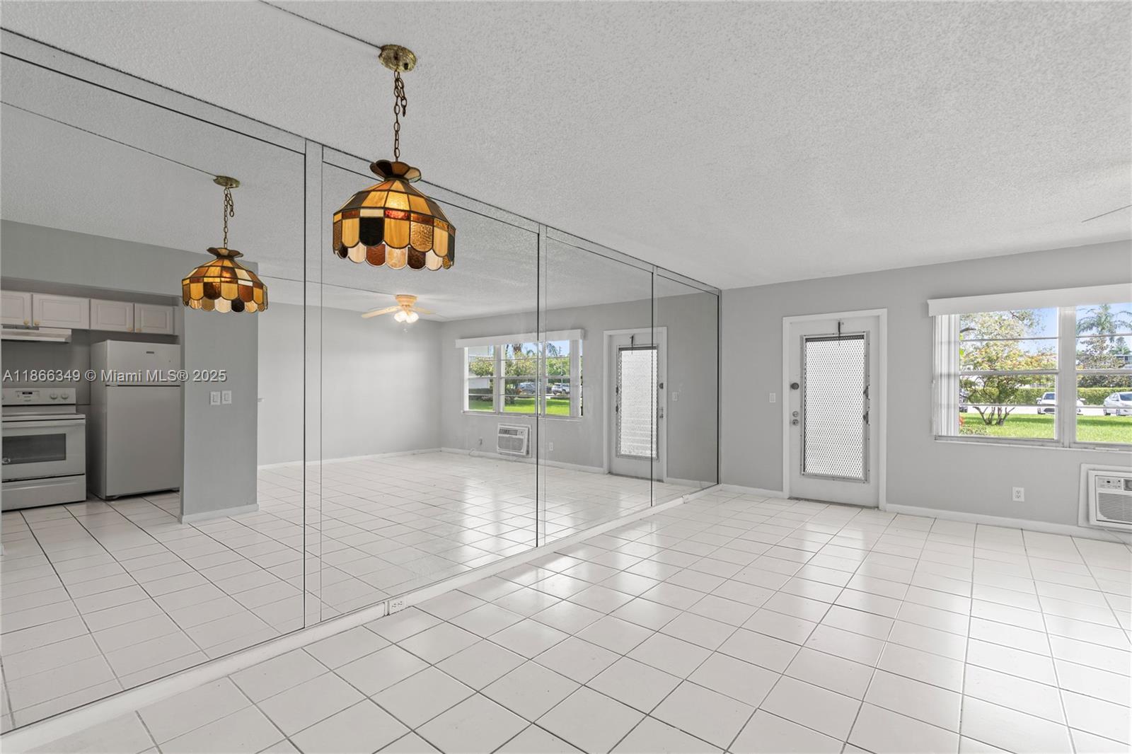 1B + 1.5B Unit. 55+ COMMUNITY. GROUND FLOOR UNIT OVERLOOKING THE LAKE FROM PATIO. TILE FLOORING, KITCHEN IN WHITE, UNFURNISHED, 10 FEET FORM LAUNDRY ROOM & MAIL. VERY LAST BLDG ON THE RIGHT SIDE FACING ALL THE TREES SO VERY QUITE AREA. SPECTACULAR CLUBHOUSE W/THEATER OFFERING LIVE SHOWS & MOVIES, LECTURES -- FITNESS CENTER -- OLYMPIC INDOOR POOL AND OUTDOOR POOLS -- TENNIS -- GUARD-GATED -- COURTESY BUSES TO MALLS, SHOPPING, RESTAURANTS, OFFICE BUILDINGS -- GOLF COURSE IS ACROSS THE STREET FROM GATE ENTRANCE. CABLE, WATER AND INTERNET IS INCLUDED. NO PETS. VACANT