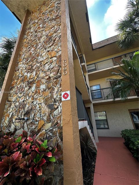 Photo of 6090 N Sabal Palm Blvd #103, Tamarac, FL 33319 (MLS # A11792507)