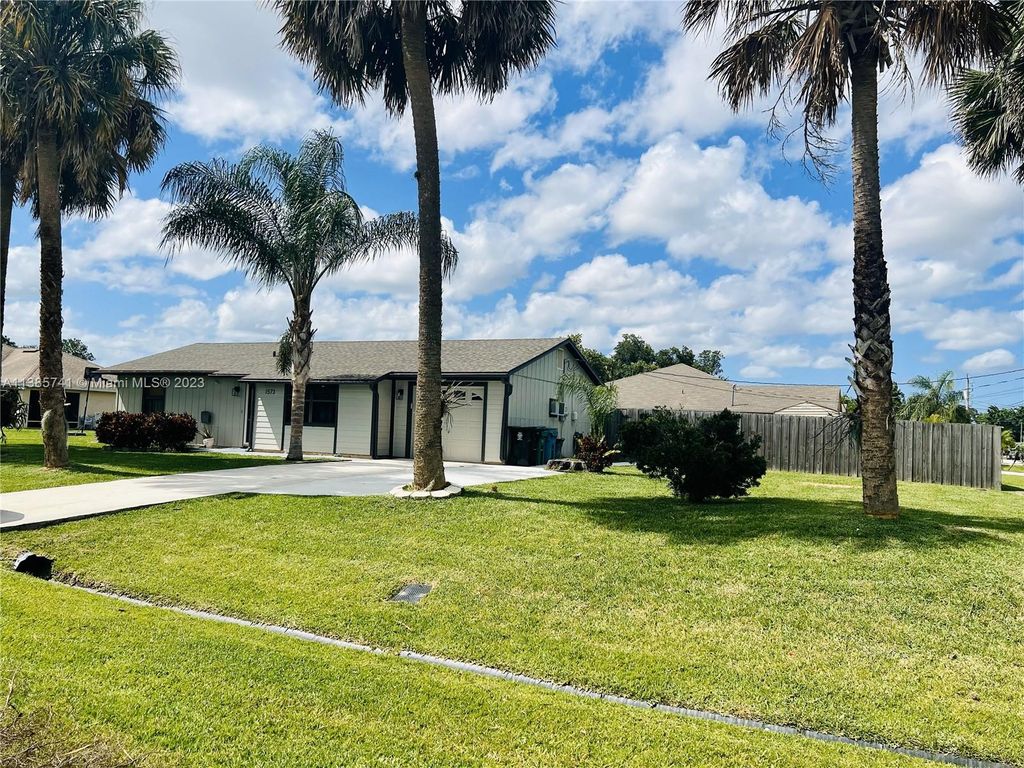 Photo of 1573 SW Lexington Dr, Port Saint Lucie, FL 34953 (MLS # A11385741)