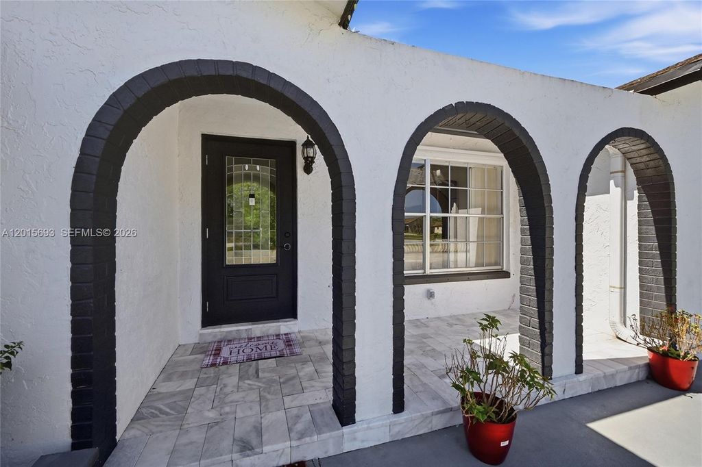Photo of 8972 SW 8th St, Boca Raton, FL 33433 (MLS # A12015693)