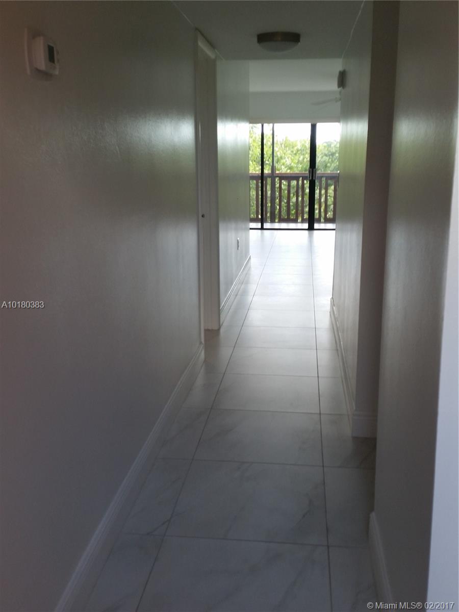 GREAT LOCATION NEAR 595 . BRIGHT AND CLEAN, UPDATED UNIT. LARGE TILE FLOORS IN ALL ROOMS. EAT IN KITCHEN, STAINLESS STEEL APPLIANCES, WASHER AND DRYER IN UNIT. UPDATED BATHROOMS, 2 BALCONIES.