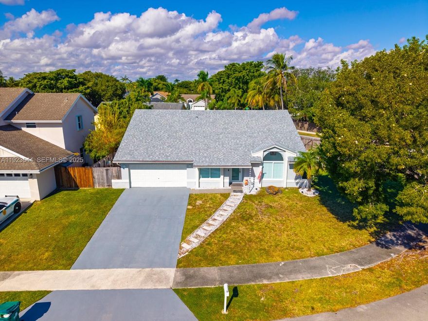 Completely remodeled, corner, stunning 4 Bedroom 3.5 bath home in Lakes by the Bay! This Move-in ready Cutler Bay residence features a 2,107 square foot open layout with a newly renovated kitchen, a large primary suite, and a 2-car garage. Enjoy a private, fenced backyard with room for a boat or RV, perfect for entertaining, featuring a full outdoor kitchen with granite countertops. The home also includes recessed lighting throughout. The community offers resort-style amenities including a pool, clubhouse, and scenic walking trails. Conveniently located near Black Point Marina, shopping, dining, and with easy access to the Florida Turnpike. Easy to show by appointment!