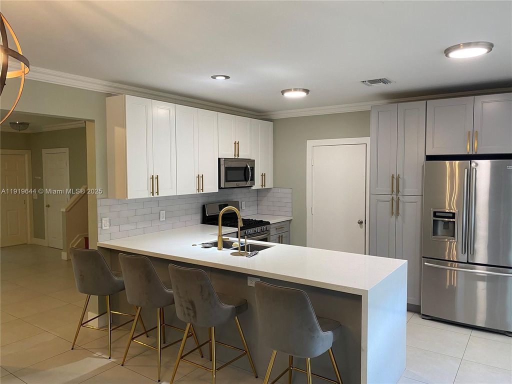 Photo of 10931 Jewel Box Ln, Tamarac, FL 33321 (MLS # A11919644)