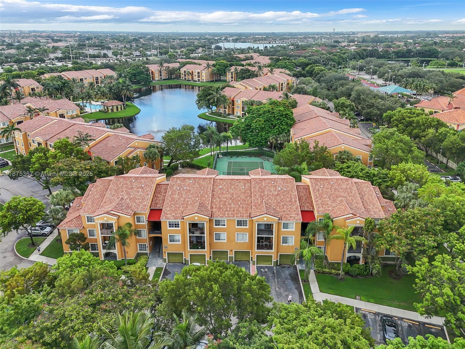 Welcome to Residences at Miramar! This spacious corner unit offers an updated kitchen with stainless steel appliances, in-unit washer/dryer, and a private balcony overlooking the tennis courts. Enjoy peace of mind with a new roof (2025) and newer A/C. Includes 2 parking spaces plus a private 1-car garage. The gated community features resort-style amenities: pool, gym, tennis court, playgrounds, and overnight security. Water included in HOA. Conveniently located near shopping, dining, and major highways.