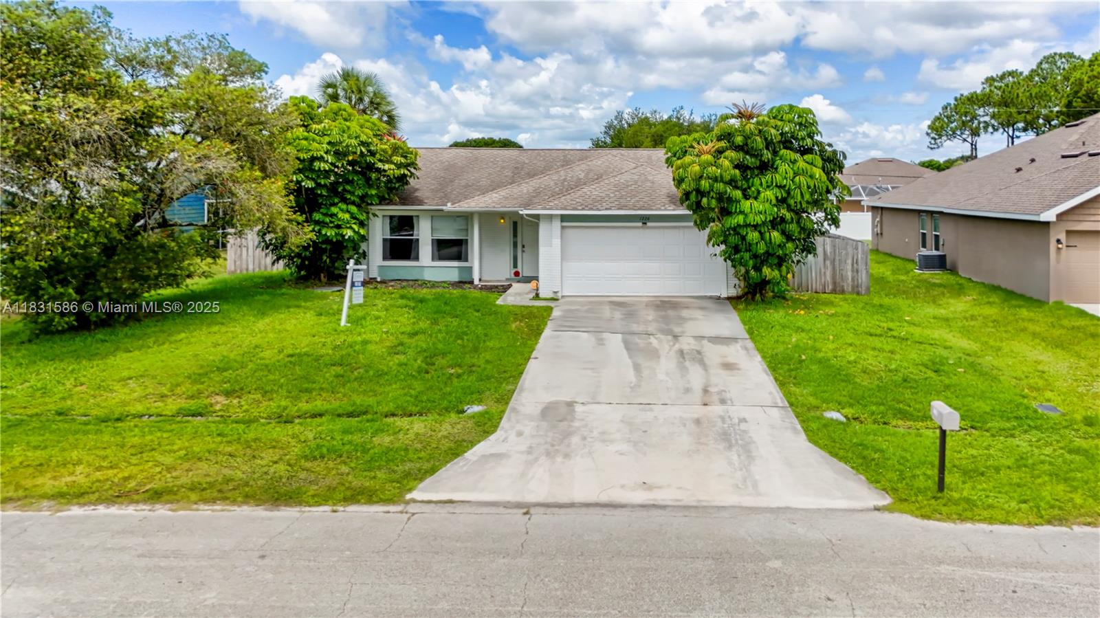 Introducing this charming 3 bedrooms, 2 baths, 2 car garage home located in Port St. Lucie. This moves in ready home was completely updated in 2018 with new AC and water heater, updated kitchen w/stainless steel appliances and granite countertops. Beautiful wood tile throughout and so much more. The large patio features a privacy fence installed in 2020, perfect for entertaining all your guests and plenty of room for a pool and your pets. Owner occupied, please text listing agents for showing instructions, 24 hours advance notice is recommended.