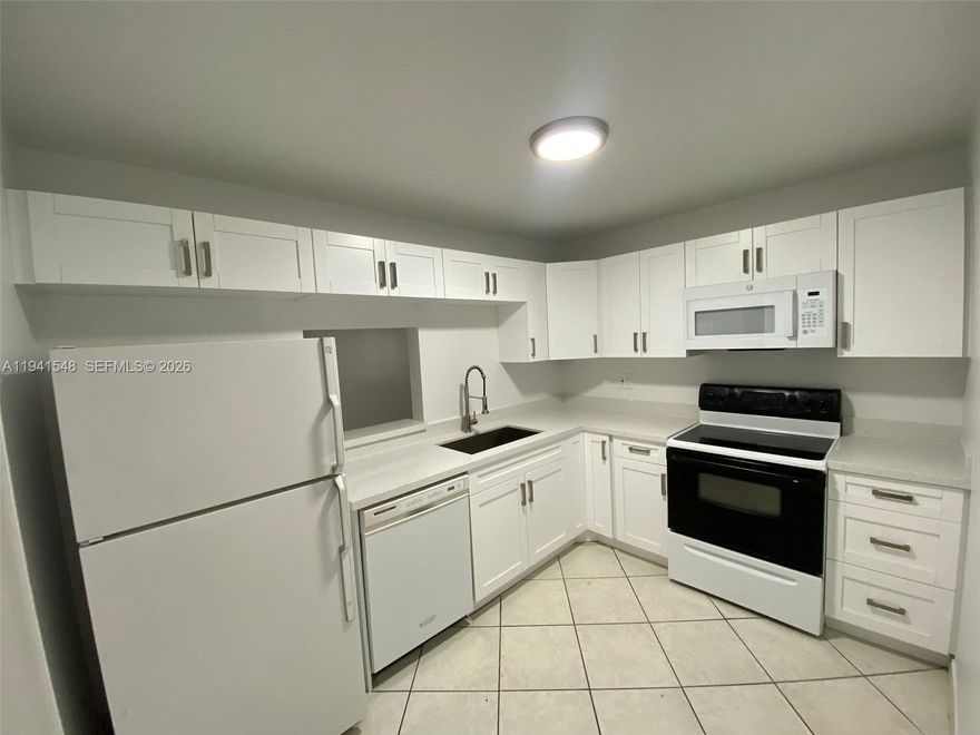 REMODELED 2/2 WITH BRAND NEW CABINETS, QUARTZ COUNTER TOPS, NEWER APPLIANCES AND NEW VANITIES IN THE BATHROOMS. LAMINATE FLOORS. SCREENED-IN BALCONY WITH A NICE. AC IS 2022. LAUNDRY ROOM AVAILABLE ON THE SAME FLOOR. QUICK HOA APPROVAL. PROOF OF FUNDS AND ADVANCE SCHEDULE SHOWING SINCE TENANT IN PLACE PAYING $1870 UNTIL 12/31/2026.