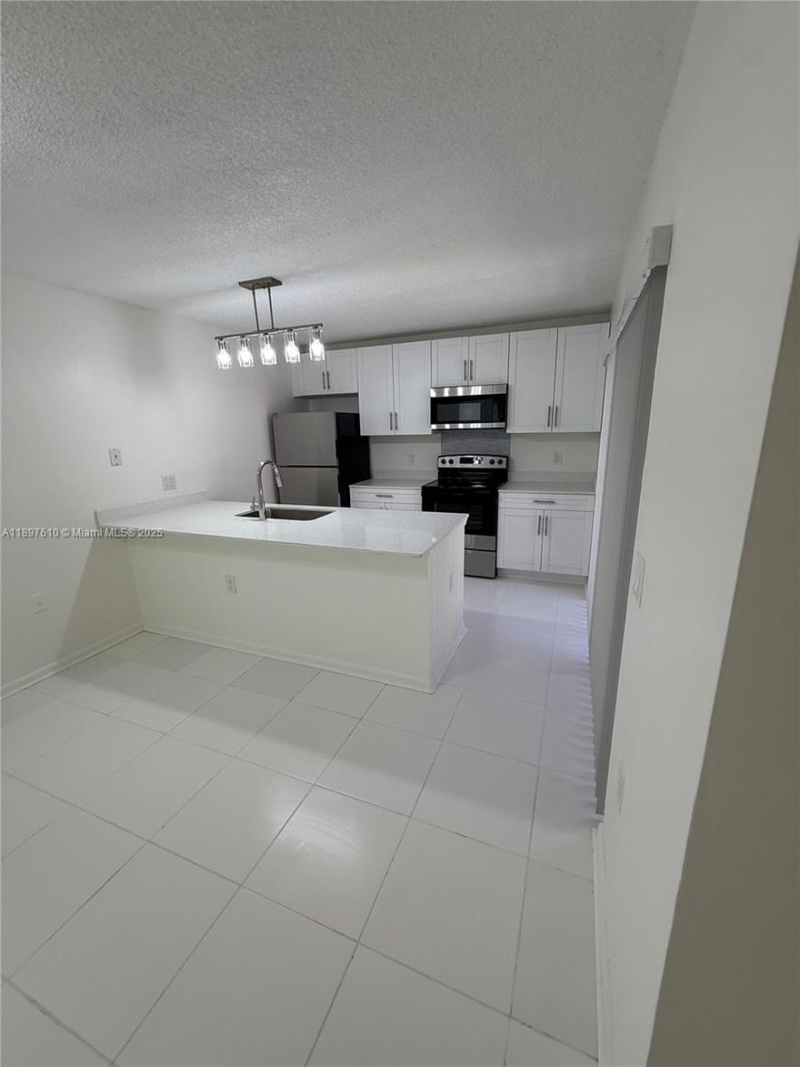 Beautiful 2/2.5 Townhouse open floor-plan, completely remodeled, new tile flooring in 1st floor and bathrooms, new wood laminate flooring on 2nd floor. New remodeled kitchen and appliances, new bathrooms, new blinds, new central ac, ceiling fans, washer/dryer in unit. A must see!