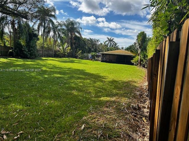 EXCELLENT Opportunity for INVESTORS, or FAMILIES who want to build their dream home. Large LOT 16,000+ sq ft. Has a 2 bed 2 bath house. The LOT is completely fenced with a car side gate which gives access to the backyard where there is room to park a boat. This offers the great options to EXPAND the existing house or BUILDING a new one. The city of Davie is conducting public works improvements. No HOA, very quiet street, yet it is near all great amenities DAVIE has to offer. For SHOWING instructions see Brokers remarks.
