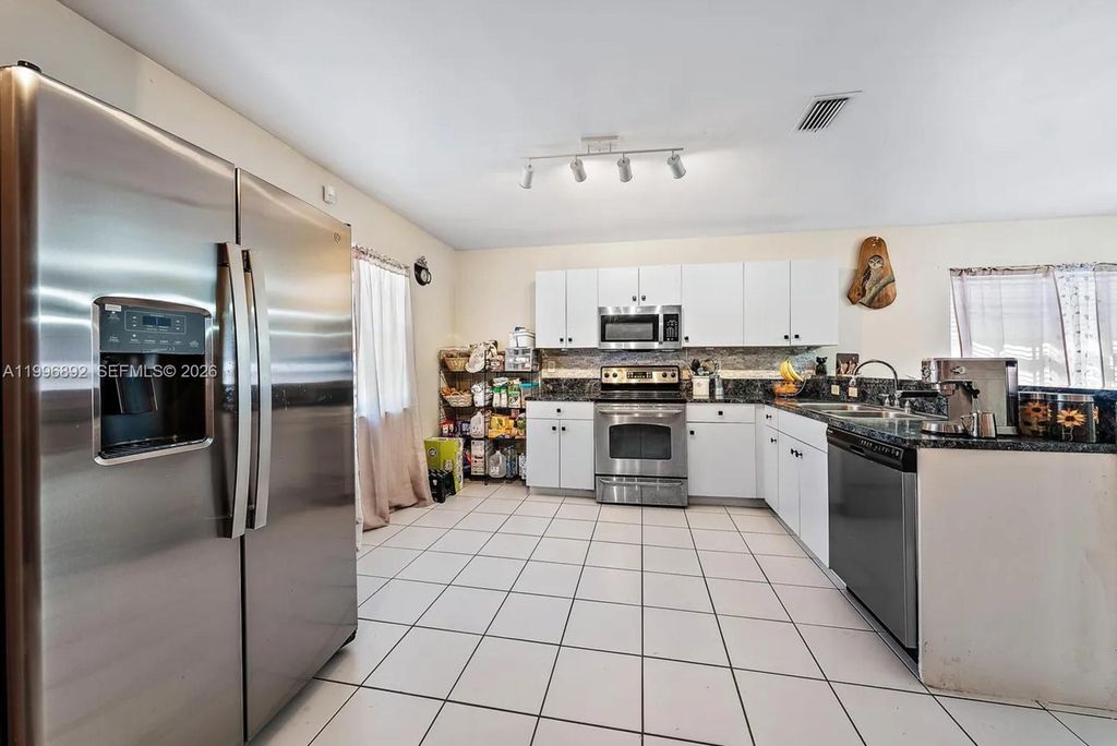 Photo of 1303 W 6th St, Riviera Beach, FL 33404 (MLS # A11996892)