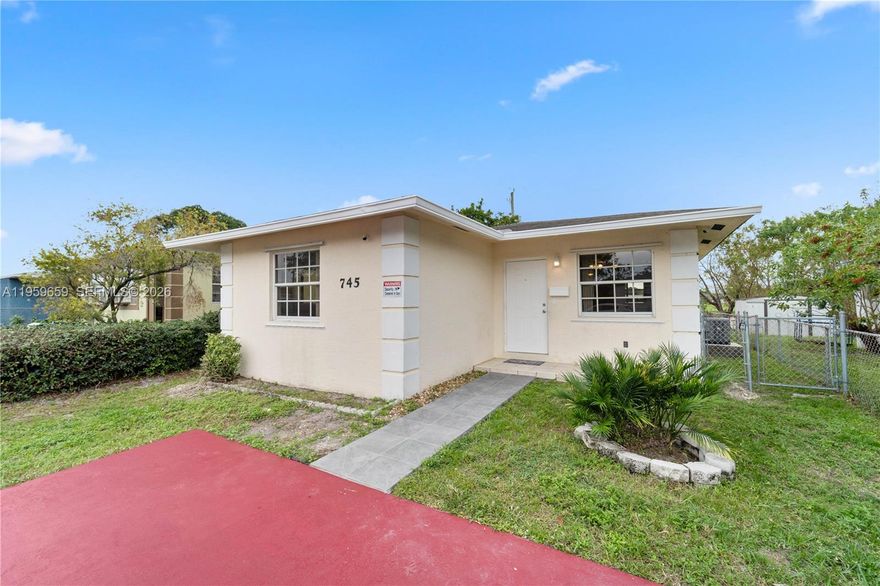 Built in 2004, this light-filled 3-bedroom, 2-bath home is ideally located in the heart of Hallandale Beach. Featuring approximately $25,000 in recent upgrades, the property offers a brand-new central A/C, new hot water heater, and new ceiling fans throughout. The open-concept layout includes a freshly painted interior, a remodeled kitchen with white cabinetry, quartz countertops, and new stainless steel appliances, including washer and dryer. Both bathrooms feature new vanities and bathtubs. Exterior highlights include a private entrance, concrete driveway with parking for two, and a fully fenced yard. Move-in ready. Ideal for primary residence or investment. Seller financing considered.