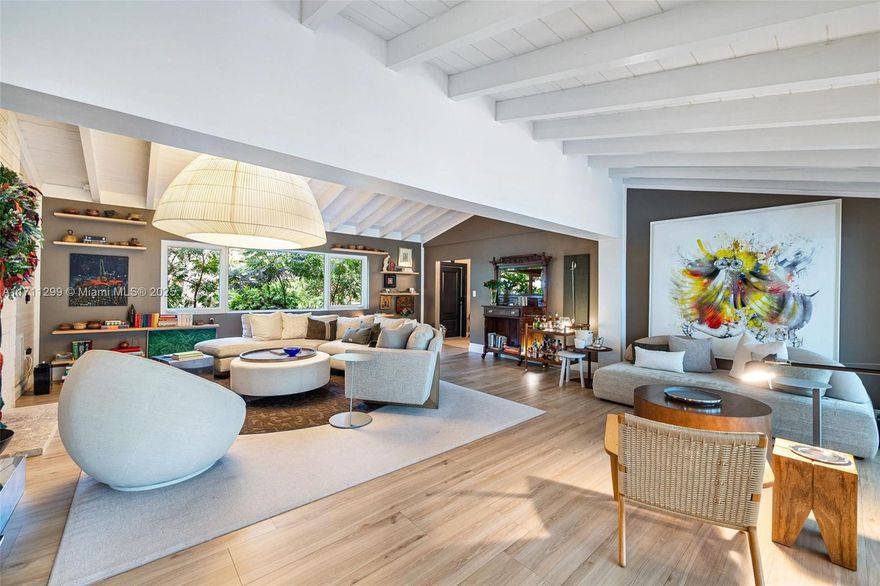 Located in the heart of South Coral Gables, this exquisitely renovated home sits on a serene 15,000 sq ft lot shaded by a stunning oak hammock just blocks from restaurants, stores and schools.  With 4 bedrooms, 4.5 baths, a dedicated laundry room with housekeeper's quarters, family room, and modern upgrades including impact windows, this home exudes both elegance and comfort.  Enjoy seamless indoor-outdoor living with an expansive terrace, a grand family room with vaulted ceilings, modern updated bathrooms plus a brand new pool currently under construction. This enchanting South Gables retreat is a rare opportunity to own a property that perfectly balances style, comfort and an unbeatable neighborhood.
