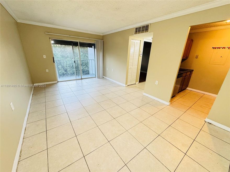 Opportunity: Discover a gem in this 1-bedroom, 1-bath second-floor condo. Ideal for savvy investors and first-time homebuyers, this property boasts modern tile and laminate floors, and one inviting bedroom. Located in a highly desirable area just minutes from Wellington Green Mall, Walmart, Best Buy, Home Depot, and an array of shopping and dining options, this condo offers not only comfortable living but also an excellent investment.----------UNIT RENTED TILL 3/31/2026, PAYS $1,500.00 PER MONTH - tenant can open the door to show the unit thursdays after 4pm