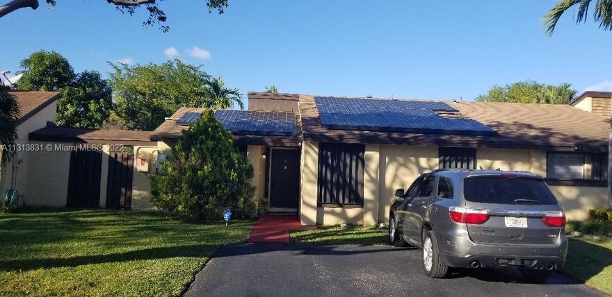 Come see this amazing townhouse located in the wonderful community Of Woodgate East! The unit is a spacious 2bdr/2bath with 1087sf  on a 237 sf lot. The kitchen is brand new, including new granite countertops, new cabinets, new stainless steel appliances, and was converted into an open kitchen. Both bathrooms have also been updated. The patio's fenced for privacy & very spacious for any kind of entertainment! The house is entirely secured with accordion shutters (can be fully secured in 5 min!) Last and most important is that this home comes equipped with SOLAR PANELS!! You will not lose power during outage from a storm or hurricane. NO HOA approval required.