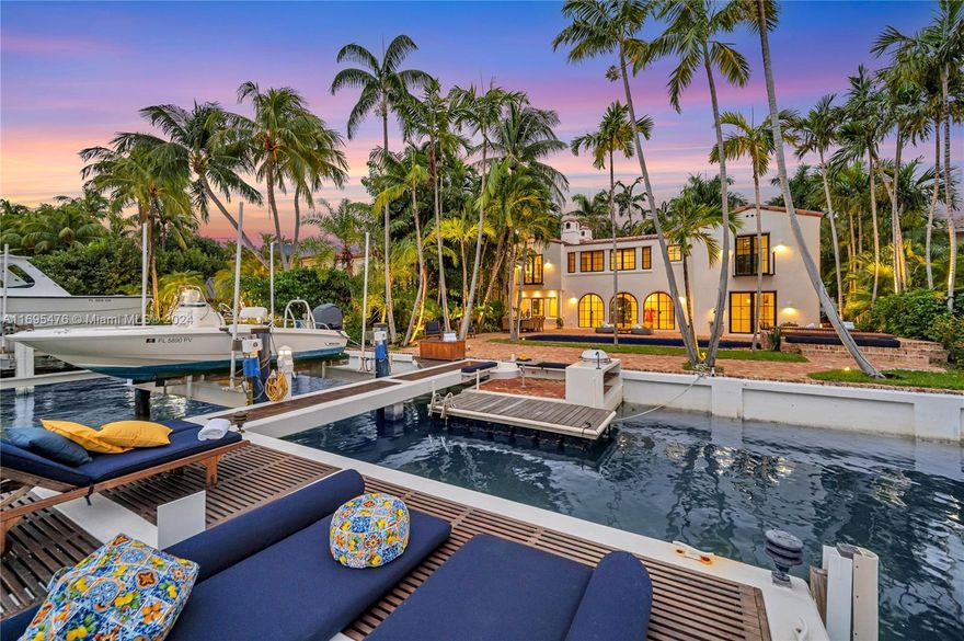 This stunning recently remodeled waterfront estate offers a perfect blend of timeless elegance & modern luxury. Set on a 10,214 Sq.Ft. lot, with 75' waterfrontage, this home features 4,697 Sq.Ft. of meticulously designed living space. With 5 Beds/4.5 Baths, the residence includes an impressive grand entrance, a gourmet kitchen & a custom wine cellar. The expansive outdoor oasis boasts a pool, lush gardens, & boat dock w/ a motorized +/-20,000Lb lift providing direct Intracoastal access with room for 2 boats. The primary suite offers unparalleled luxury experience, w/ a spa-like en-suite bath.  Located on prestigious Pine Tree Drive, this estate home is just minutes away from world-class dining, shopping, schools & within walking distance to the beach.