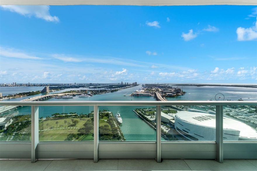 A truly one-of-a-kind residence offered for sale at 900 Biscayne Bay. This exceptional apartment offers a floor plan found nowhere else in the building. Originally two neighboring units, the owner masterfully combined them to create a spacious 4-bedroom, 4-bath home spanning over 2,700 interior square feet plus three separate balcony areas. Fully remodeled with meticulous attention to detail, the residence showcases refined luxury throughout, featuring custom finishes, bespoke wood millwork, and thoughtfully designed custom cabinetry. Four-foot by four-foot Italian porcelain tile floors run seamlessly through the entire home, complemented by luxury lighting fixtures that enhance the modern ambiance. The chef’s kitchen is equipped with premium Sub-Zero refrigeration, a Miele stovetop, and elegant marble countertops. All bathrooms have been completely updated, with both primary baths featuring marble tile, rainfall shower heads, and spa-inspired finishes. Enjoy spectacular sunrise and sunset views from three separate balconies, offering sweeping panoramas of Biscayne Bay, Downtown Miami, Port of Miami, and Miami Beach. Additional highlights include a private elevator entrance, separate service entrance and two assigned parking spaces. Residents of 900 Biscayne Bay enjoy world-class amenities including a state-of-the-art gym, sauna, steam room, jacuzzi, cold plunge, resort-style pool, screening room, and valet service—delivering an unmatched Miami lifestyle.