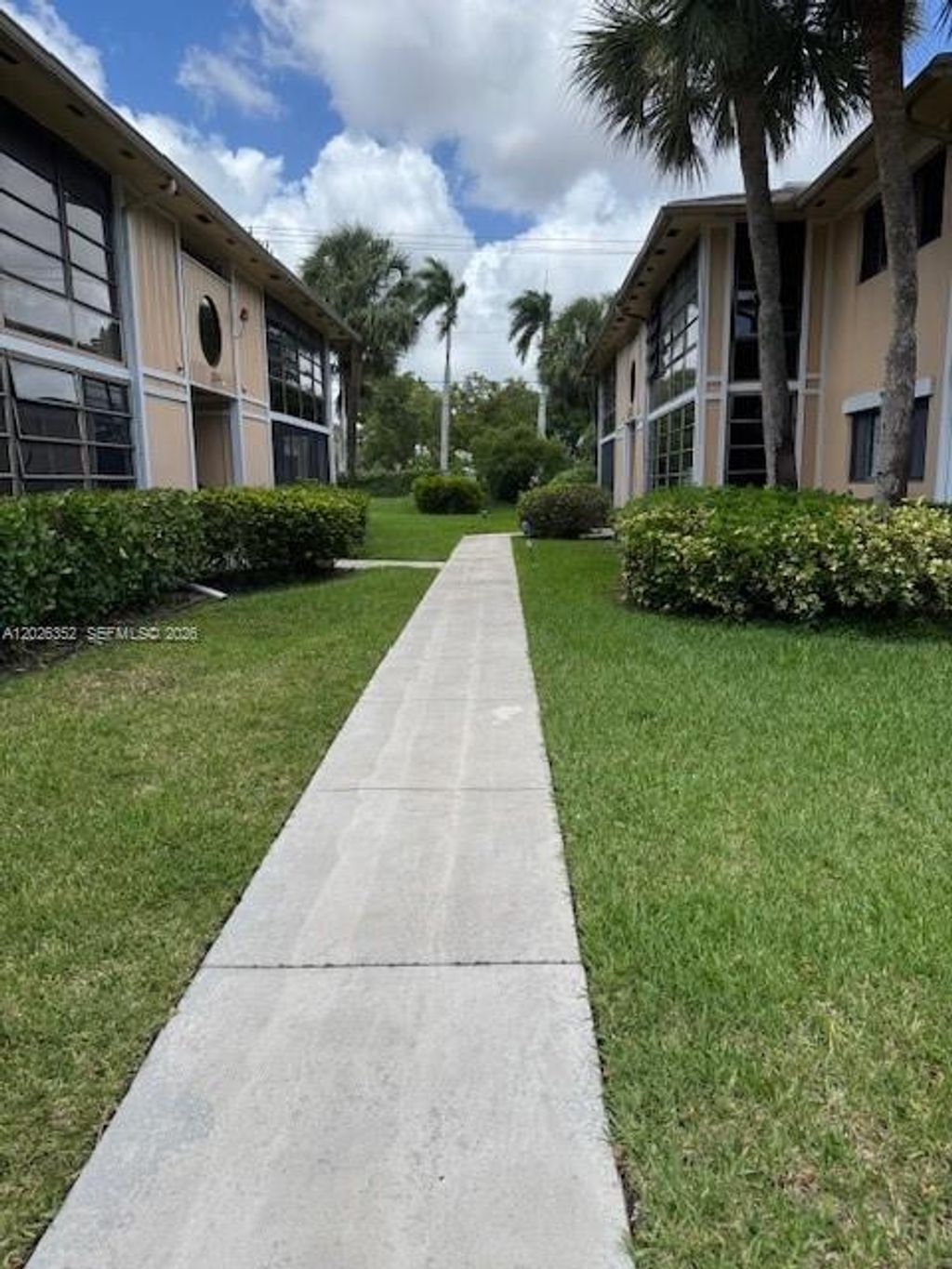 Photo of 7178 Ashmont Cir #108, Tamarac, FL 33321 (MLS # A12026352)