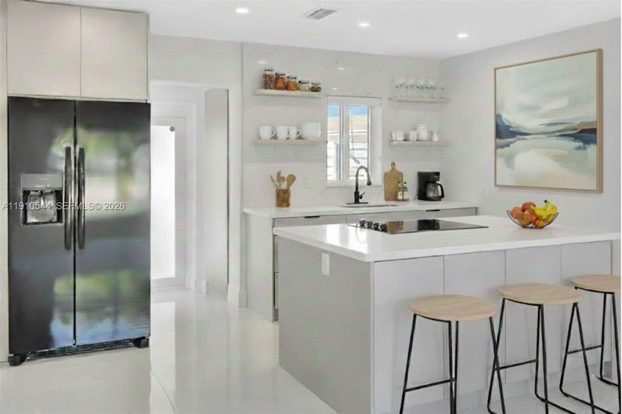 Welcome to 9851 Jamaica Drive, a stunningly renovated residence offering modern comfort and style in one of Cutler Bay’s most desirable neighborhoods. Every detail has been thoughtfully updated, making this home truly move-in ready!
Step inside to discover new tile flooring, a brand new kitchen with custom pantry, island, and brand-new stainless steel appliances — perfect for entertaining and family gatherings. The home features two fully remodeled bathrooms, custom closets, and all new interior and closet doors, bringing a fresh and cohesive look.
Enjoy bright, open layout enhanced by new recessed lighting and custom ceiling fixtures, creating an inviting atmosphere. The laundry room has been upgraded with custom cabinetry and a new stackable washer and dryer for added convenience