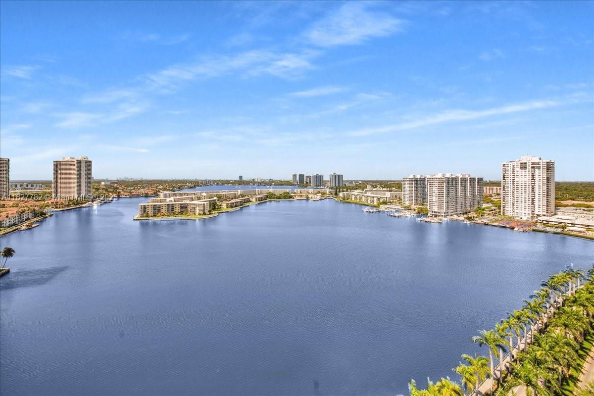 The square footage and the beautiful vistas are all yours. Lovely 2/2 lake front condo in the beautiful City of Aventura. Naturally bathed in sunlight this well proportioned corner unit @ ADMIRALS PORT offers gracious living spaces w/additional den/flex area, floor to ceiling glass sliding doors, wraparound balcony and a wealth of amenities. Location! Upscale shopping, fine dinning & cultural attractions within walking distance + Oleta River State Park nearby for fitness & relaxation. Unit is perfect for a permanent home or a fun getaway. A Rated Schools. Pet friendly. Aventura is conveniently located between Miami & Ft. Lauderdale making it easy to access both cities & their International Airports. Qualified Buyer a Must. By Appointment Only. Please TEXT Listing Agent ELENA LAUTER.