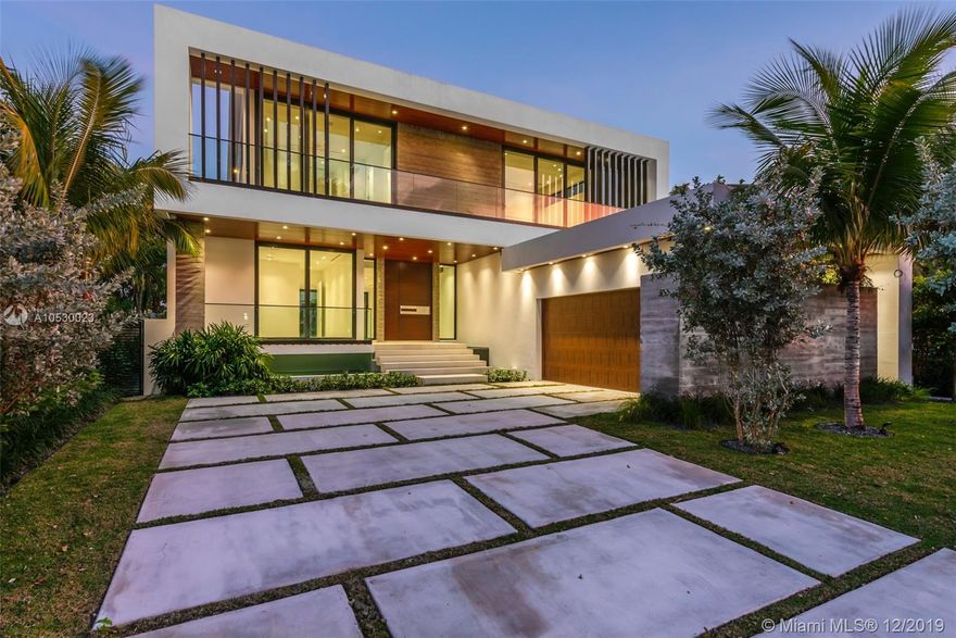 Spectacular water views from the moment you step inside this modern architectural gem! High end finishes & superb attention to detail throughout. Floating steps & gorgeous water feature greet you as you ascend to the mahogany front door. Floor to ceiling impact glass & soaring 12-24 ft ceilings invite lots of natural light. Enjoy open living areas, private elevator & Wolf/Subzero kitchen boasting enormous island & endless storage. Perfect home for indoor & outdoor entertaining w/it's oversized roof top terrace & sun deck, outdoor summer kitchen, midnight bar, infinity edge pool, Jacuzzi & 68 ft of prime waterfront w/boat dock. An ideal family retreat in this secluded neighborhood! Walk to beach, schools, restaurants, Bal Harbour Shops & houses of worship. Stunning home! No expense spared!