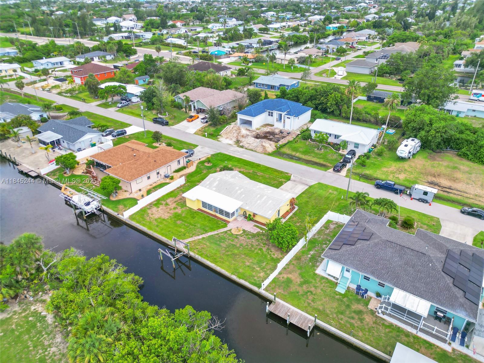 WATERFRONT!!! 100 FT SEA WALL!! LOCATION, LOCATION, LOCATION!! BRING YOUR BOAT!! 20 MINUTES BOAT RIDE TO THE HARBOR. 2 FIXED BRIDGES- COMPLETELEY REMODELED! BRAND NEW KITCHEN CABINETS AND APPLIANCES! BRAND NEW BATHROOMS! BRAND NEW FLOORING! BRAND NEW INTERIOR PAINT! NO ASSOCIATION! HUGE BACKYARD, PARTIALLY FENCED w/ Enough space to park your Truck, RV, Trailers & Toys. OVERSIZED 2-Car garage with a spacious driveway, PETS WELCOMED! MINUTES FROM DOWNTOWN PUNTA GORDA, MARINAS, RESTAURANTS, SHOPPING, ETC. BEAUTIFUL AND QUIET NEIGHBORHOOD!!! SEWER WATER AND SEPTIC TANK > REDUCES YOUR WATER BILL IN HALF! Fish from your Backyard! Situated Minutes to Fisherman’s Village, Isles Yacht Club, Gilchrist Park, Ponce De Leon Park, Historic Downtown Punta Gorda Marinas..