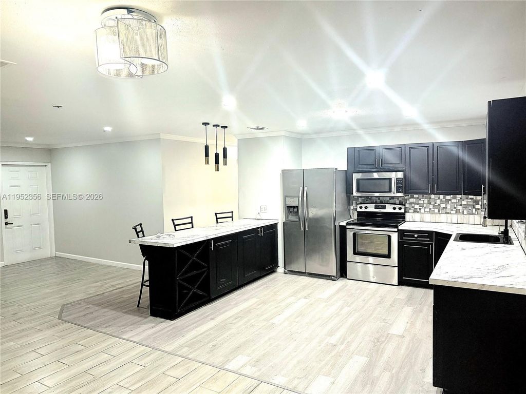 Photo of 1822 SE Oxmoor Ct, Port St Lucie, FL 34952 (MLS # A11952356)