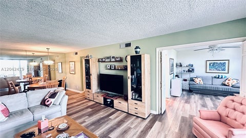 Photo of 2671 S Course Dr #208, Pompano Beach, FL 33069 (MLS # A12042479)