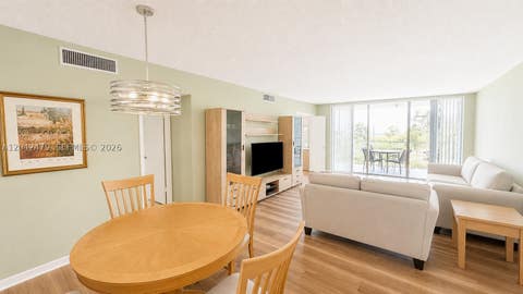 Photo of 2671 S Course Dr #208, Pompano Beach, FL 33069 (MLS # A12042479)