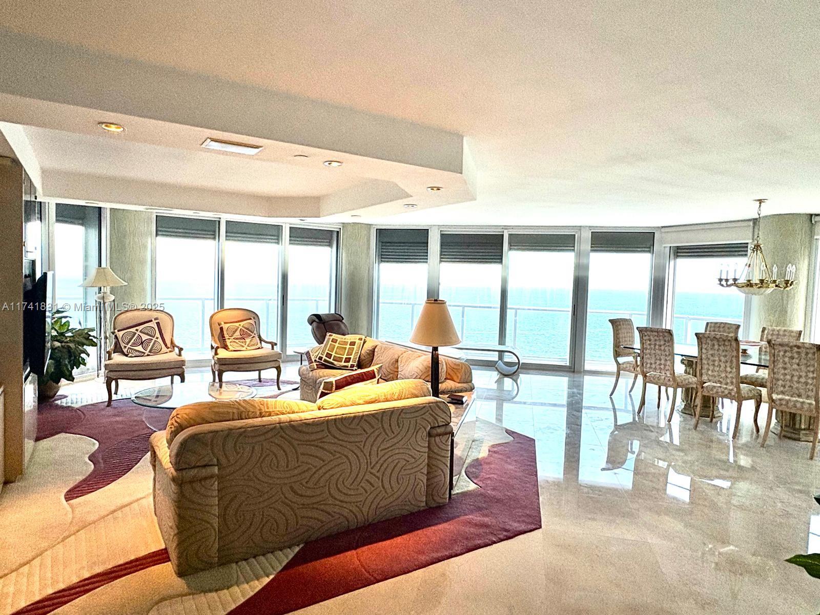 This true 3-bedroom, 3-bathroom unit offers breathtaking, unobstructed ocean views with no interference from neighboring buildings. The expansive corner layout features a wrap-around balcony, a dedicated laundry room, walk-in closets, and additional storage space within the building. Assigned parking is included for your convenience. Seasonal rental available (6 months) Located in the prestigious Oceania development, residents enjoy world-class amenities, including a health club, spa, fine dining restaurants, tennis courts, racquetball, and a marina. Contact the listing agents for access and further information. Special assessment paid in full.