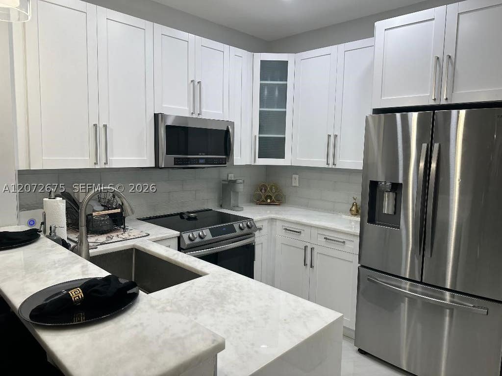 Photo of 7690 S Southwood Cir, Davie, FL 33328 (MLS # A12072675)
