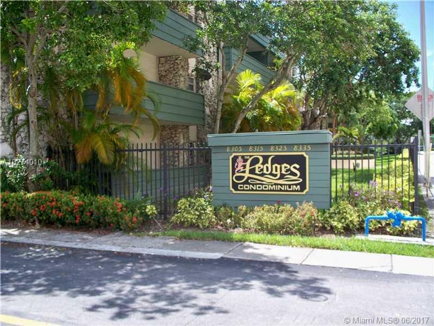 Amazing 1263 Square Feet!  Largest Ledges unit, private corner facing north. Like a small home. Two big  bedrooms.  Split plan-one side having adjoining den with bedroom and bath, other side with private large master, walk in closet and bath.  Recent improvements include: painting, new wood floors, bathroom and kitchen updates. Closest complex to Metrorail. Within walking distance to Dadeland Mall/Station.  Metrorail goes directly to Airport. 10 mins to UM CG campus. Near Baptist/SM Hospitals.  Well kept complex with pool, tennis and security cameras.  Larger and lower price than new construction nearby. No dogs per association.