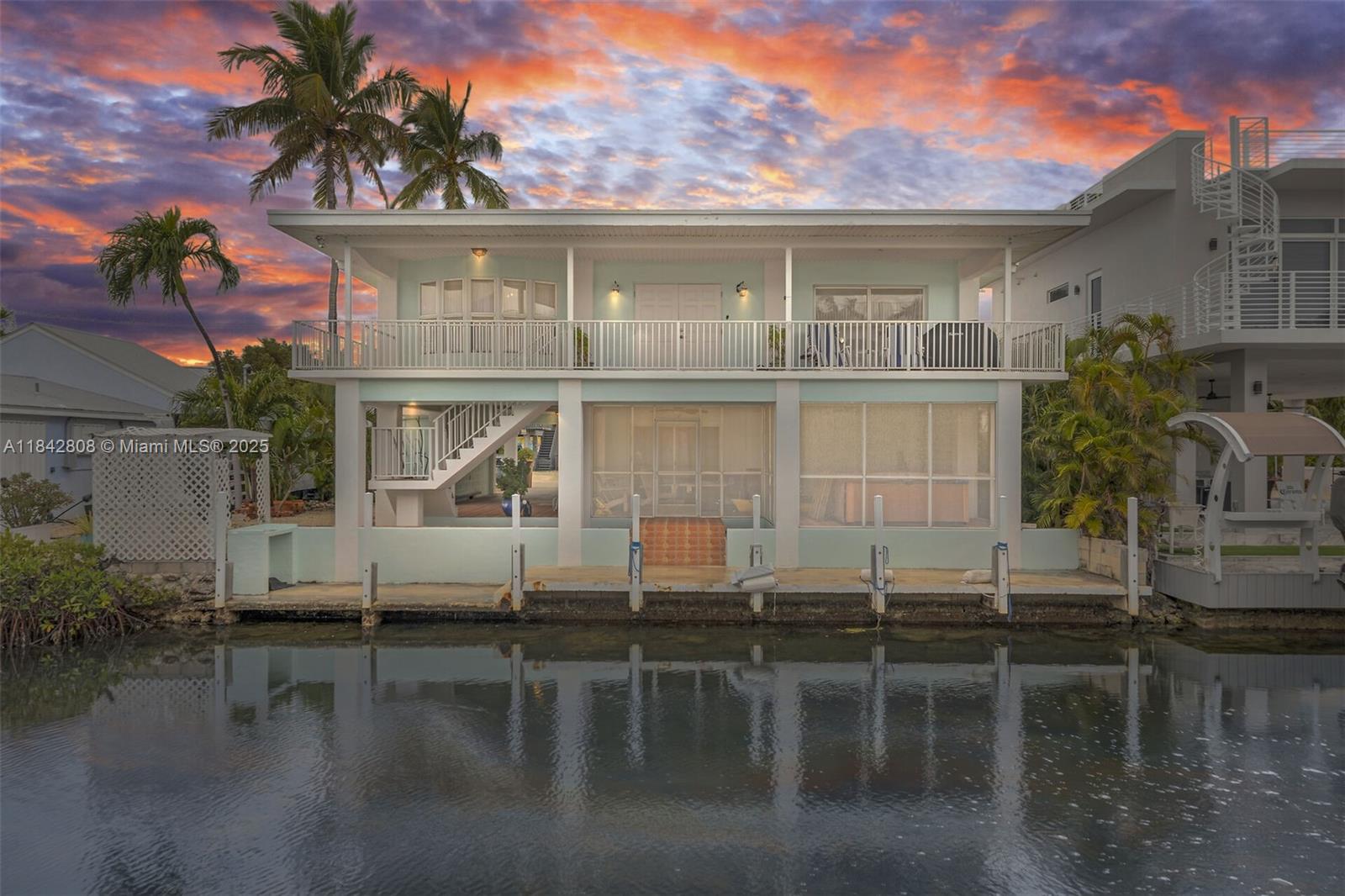 MOTIVATED SELLERS! 4-Bedrm, 4-bath concrete home impact windows & doors. Spacious living area, formal dining, large bedrooms, walk-in pantry, separate vanity in primary bath, cedar-lined closets, massive game room Large screened room w hot tub overlooking 60 feet of concrete dockage, boater's dream, easy access to the Ocean. Pr-firm downstairs living space is perfect for line-in caretaker or supplemental income. Nestled between Islamorada & Marathon w/ much to offer! Post Office, fire department, restaurant & bar, community pickleball court, Long Key State Park with nature trails, within walking & biking distance. If you're looking for a private retreat or a versatile compound for work and play, this property is ready for your vision to make your dream of paradise a reality. BRING OFFER!