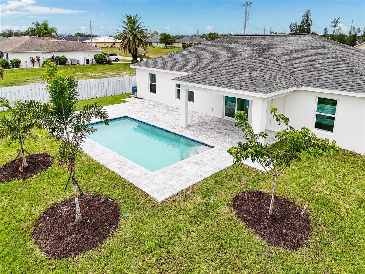 $10,000 CLOSING COSTS PAID BY BUILDER! NEW CONSTRUCTION HOME WITH POOL & TILE FLOORS! Live life in the sun in this brand new pool home featuring TWO MASTER SUITES, both with full baths and walk-in closets! NO FLOOD ZONE + IMPACT WINDOWS = LOW INSURANCE. The home includes 4 bedrooms and 3 full baths. The open layout connects to a lanai, paver patio, and HEATED POOL. The modern kitchen features stainless steel appliances, wood cabinetry, quartz countertops, and a large island with breakfast bar. Wide open spaces with vaulted ceilings and luxurious hard surface flooring throughout the home.