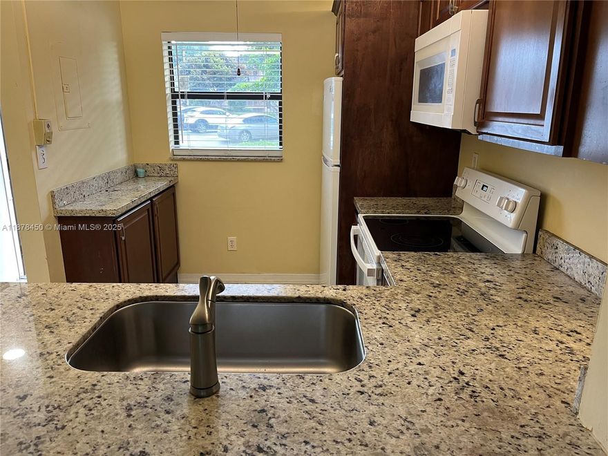 Beautiful 2 bed room, 2 bath room, GROUND FLOOR - CORNER UNIT with peaceful WATER & GOLF VIEW in an extremely WELL MAINTAINED COMMUNITY, Unit updated with neutral colored tile through out, granite counter tops, new kitchen cabinets, sink, blinds and NEW AC. Also features screened patio with additional storage space and ACCORDION SHUTTERS, 1 assigned parking space just out side the front door and plenty of guess parking steps away, unit located close to pool and mail boxes. Fairview is centrally located in the heart of Pembroke Pines just minutes away from Pembroke lakes Mall, many local restaurants and outside mall, CB smith park, memorial Hospital West and easy access to major roadways and highways.