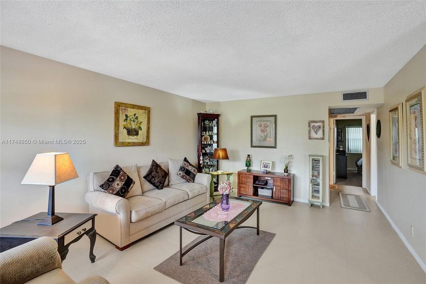 This 2/1.5 is ready for a new owner! NEW ROOF 2022! White neutral kitchen with STAINLESS STEEL APPLIANCES. Spacious WALK-IN CLOSET in 2nd bedroom. A/C 2021. ACCORDION SHUTTERS on front. ENCLOSED LANAI W/ WINDOWS in the back, great as a sun room or extra storage. NO SPECIAL ASSESSMENTS! Enjoy all Century Village has to offer, including live theater, pools, clubs, pickleball, tennis, shuffleboard, card room, billiards and so much more. Within 10 minutes of major shopping, highways, entertainment and airport with shuttles to many destinations. You will have it all!  OK TO LEASE, ONE YEAR MINIMUM. Association approval required. Easy to show. *READ BROKER'S REMARKS.*