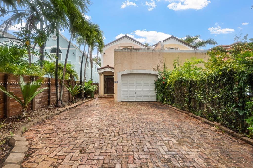 Meet fabulous Mary! 3-bedroom, 2.5-bath townhome with a private pool in the heart of Center Grove is a must-see! Located near CocoWalk, top-rated schools, lush parks, and Biscayne Bay, the home offers the perfect blend of style and convenience. Featuring marble and wood floors, the open living space flows seamlessly into a spacious kitchen with stainless steel appliances and a gas range. The light-filled family room opens to a covered porch and a private backyard oasis with pool. Upstairs, you'll find two well-sized bedrooms and a generous primary suite with walk-in closet and private terrace. The property is fully fenced with an electric gate and includes a one-car garage. Location, location!!